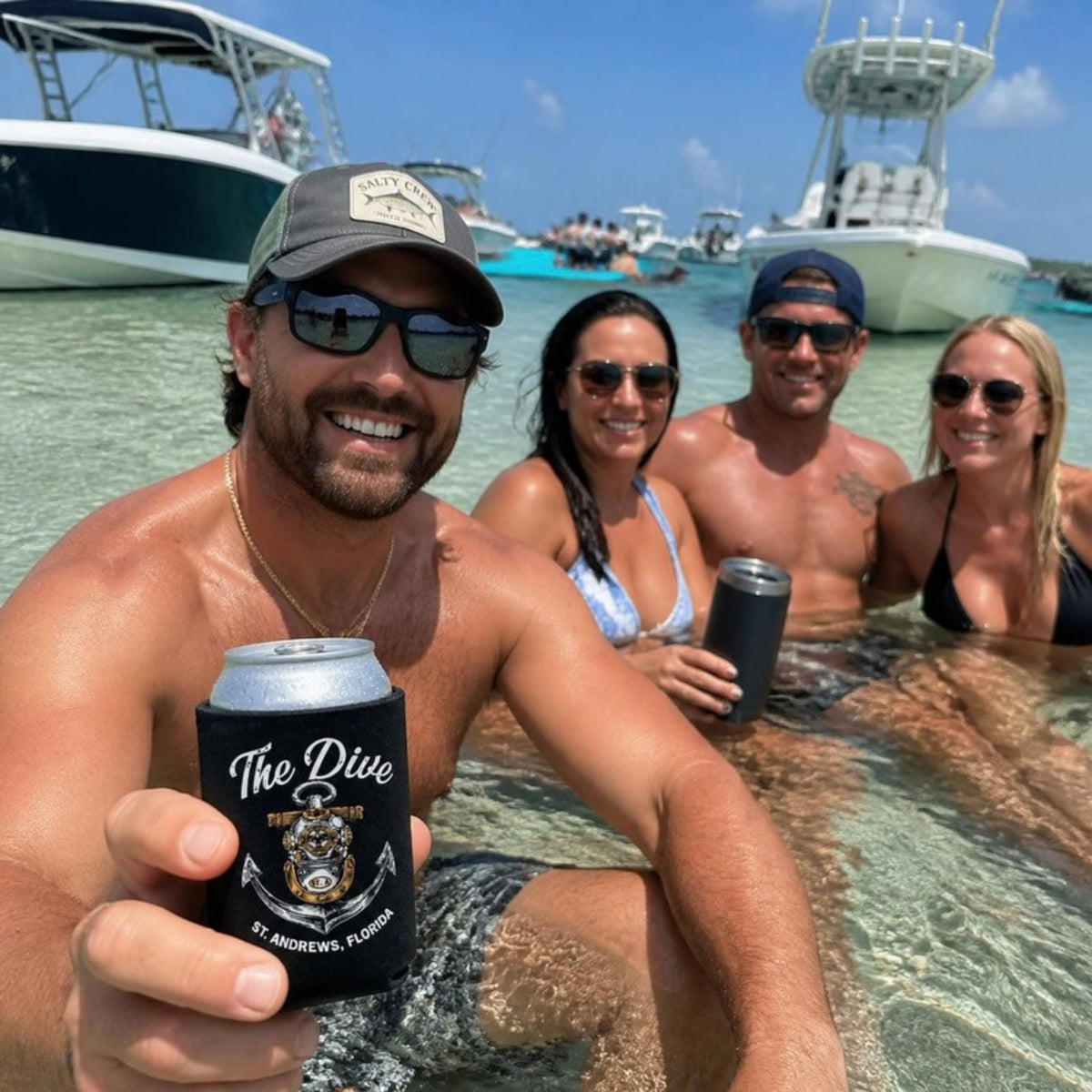 Friends on a sandbar with The Dive can koozie
