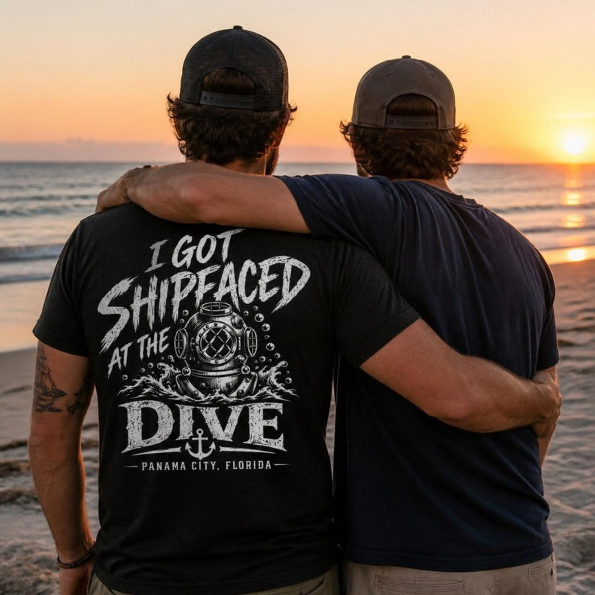 Friends watching the sunset, one in the Shipfaced t-shirt