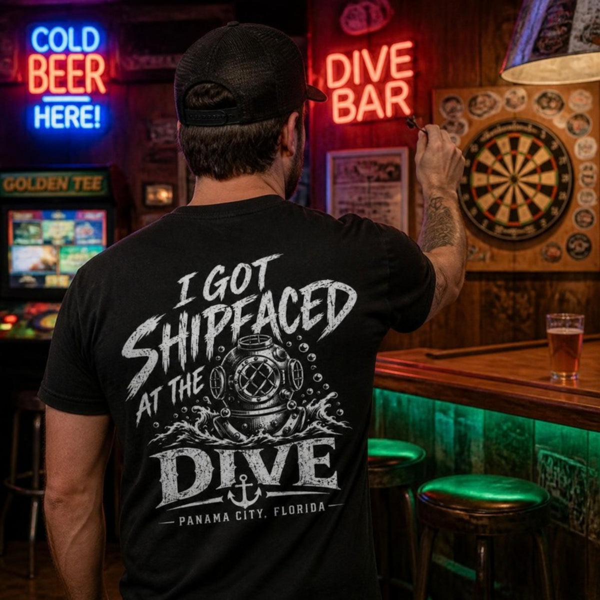 Man playing darts in the Shipfaced t-shirt