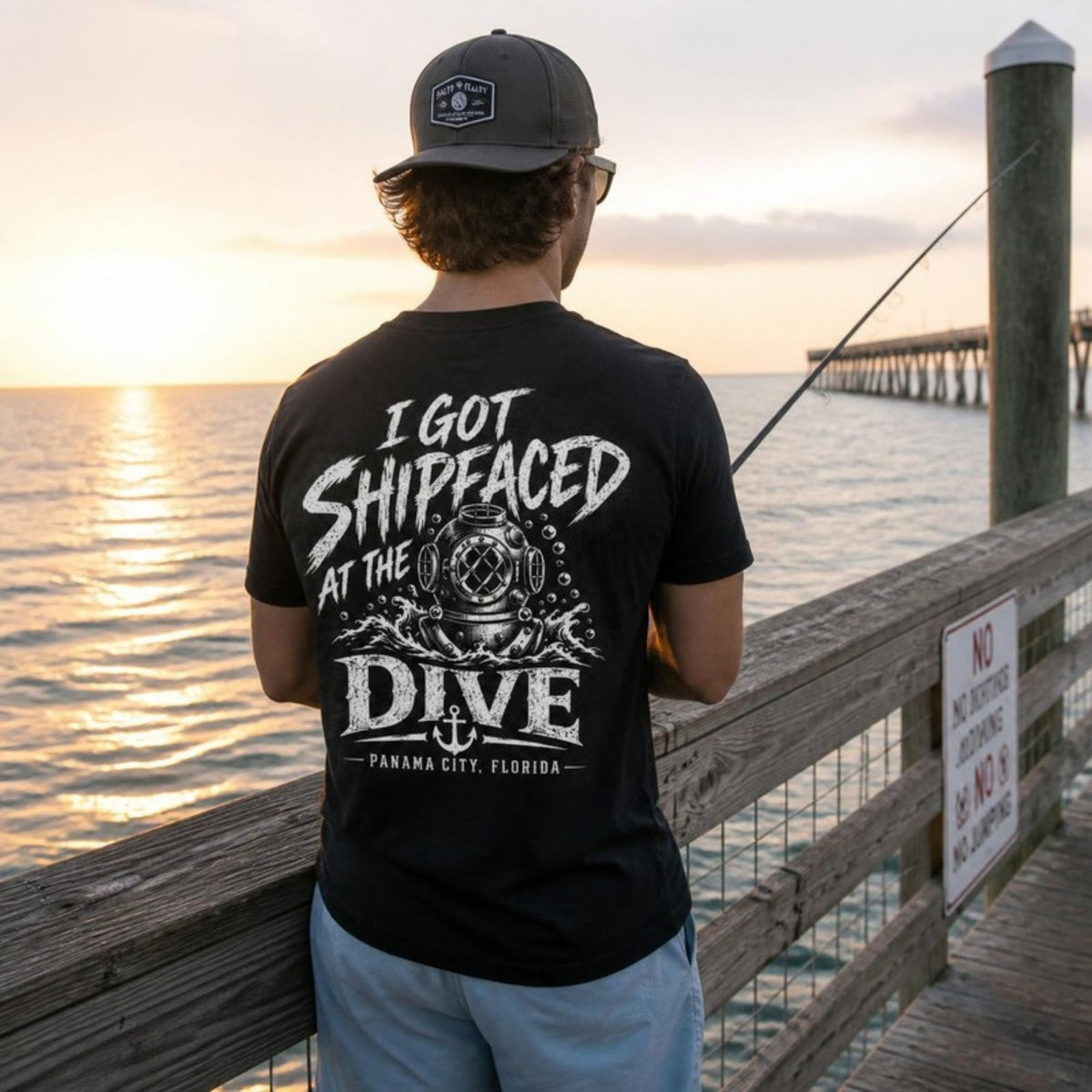Man fishing off a pier in the Shipfaced t-shirt