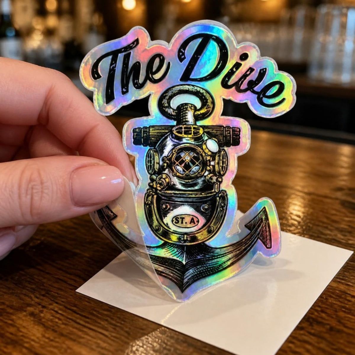 Peeling The Dive holographic sticker at the bar
