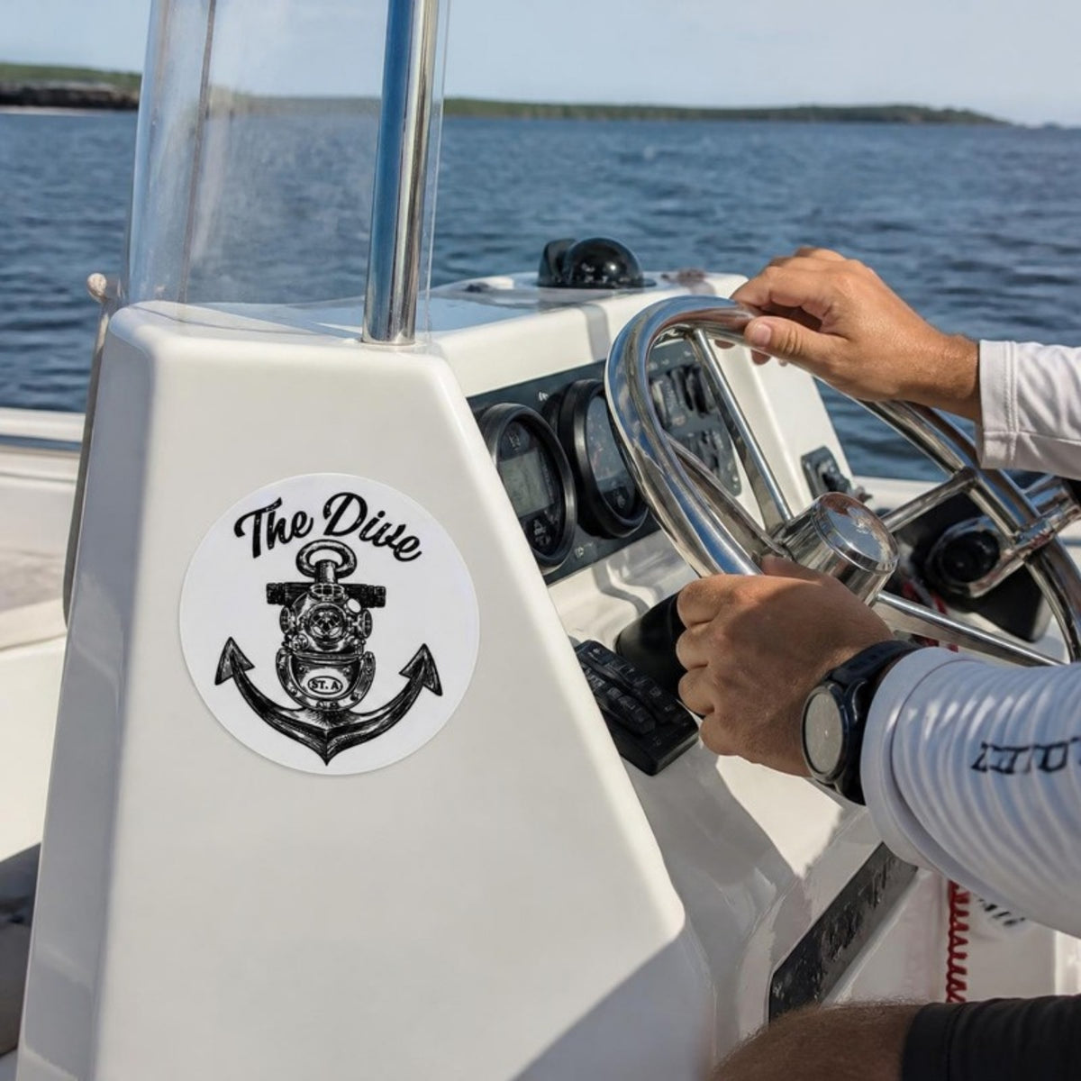 The Dive round sticker on a boat console