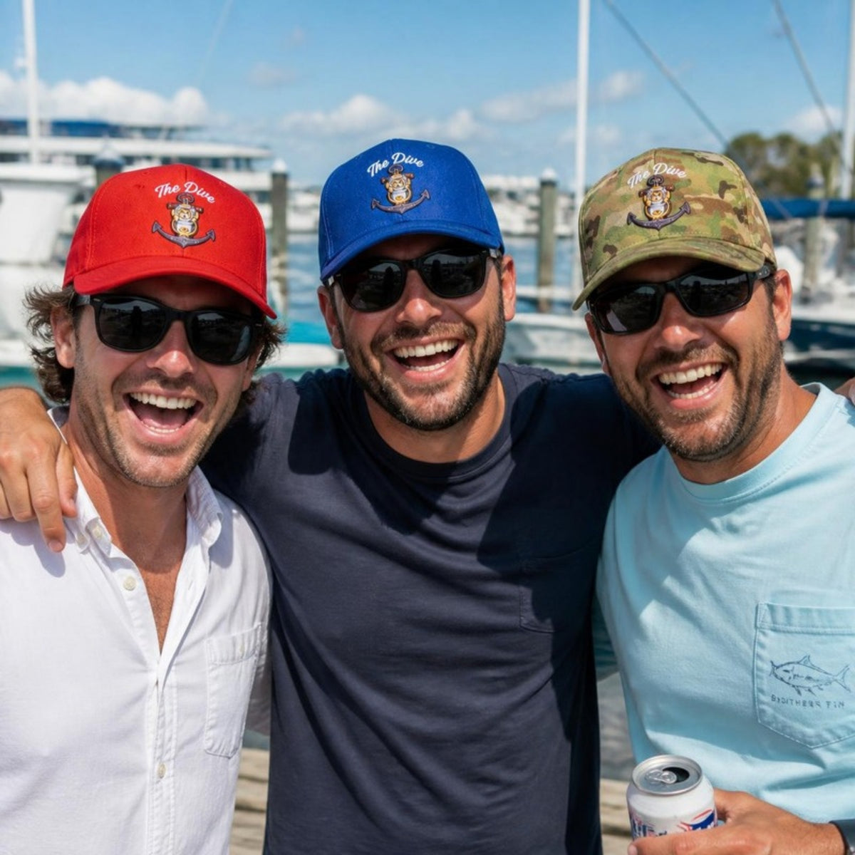 Friends in red, blue and camo Dive hats at the marina